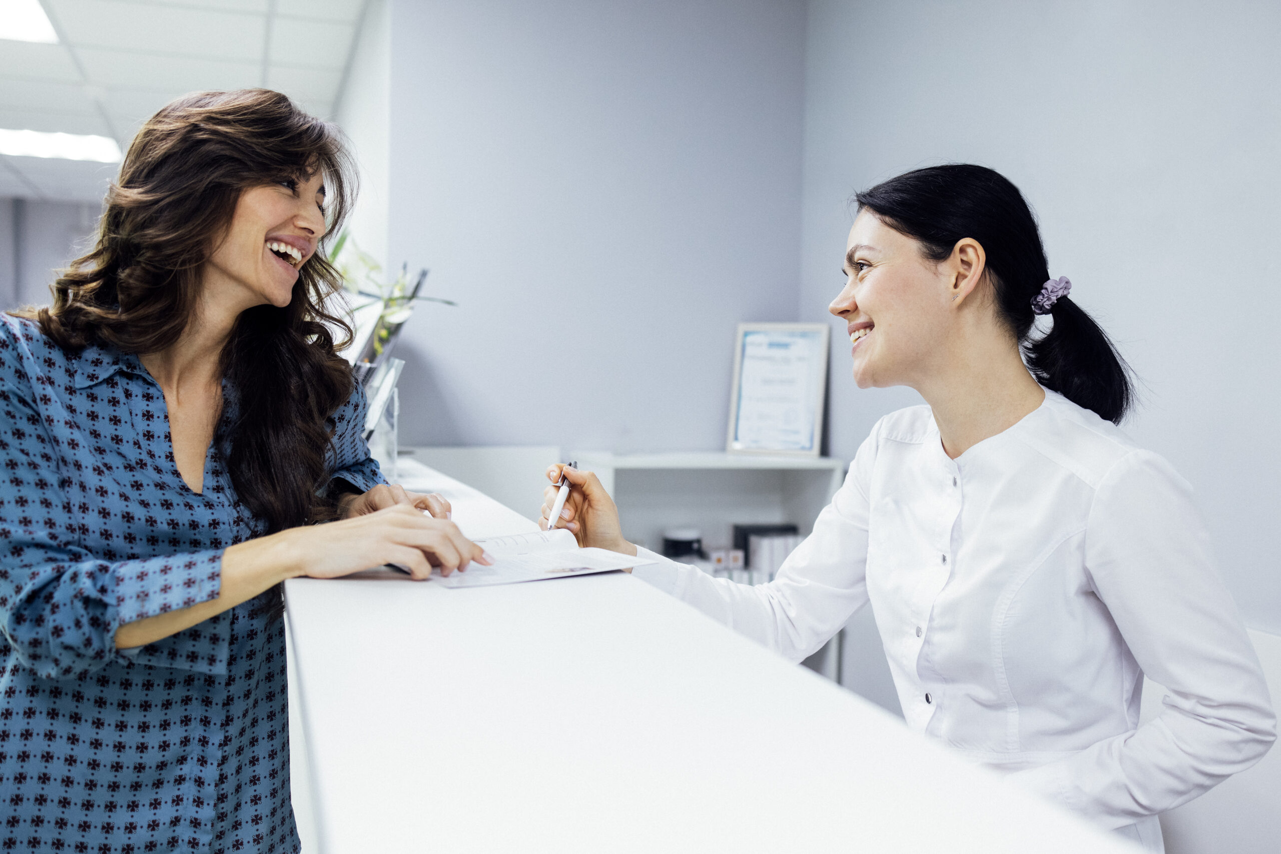 Businesswoman using a tablet in a modern medical clinic